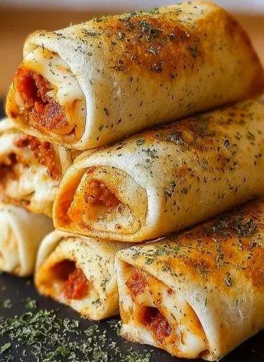 High protein pepperoni pizza rolls served on a plate