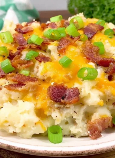 Delicious twice baked potato casserole topped with cheese and chives