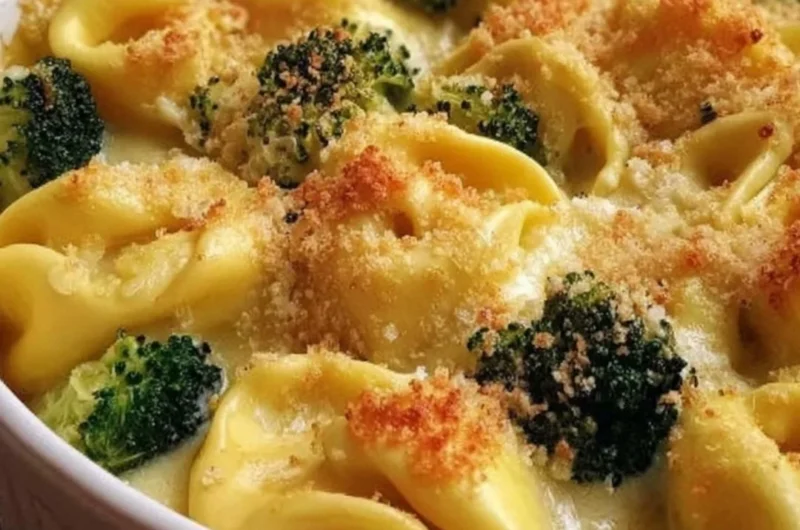 Creamy cheesy tortellini bake with broccoli in a baking dish