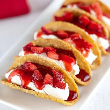 Delicious easy cheesecake tacos with creamy filling and sweet toppings
