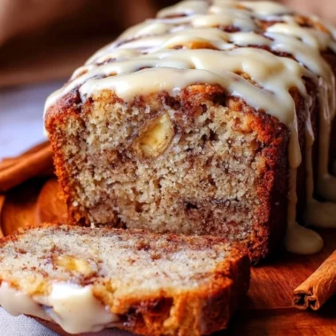 Loaf of easy cinnamon roll banana bread with cinnamon glaze