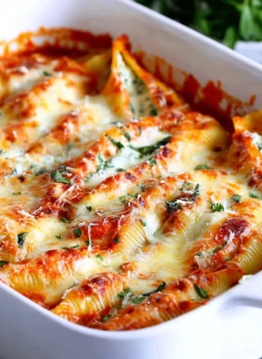 Easy stuffed shells filled with ricotta and marinara sauce on a plate.