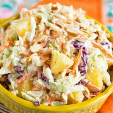 Bowl of Hawaiian coleslaw with pineapple and colorful veggies