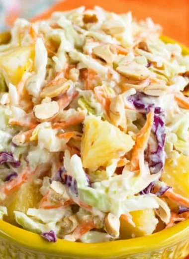 Bowl of Hawaiian coleslaw with pineapple and colorful veggies