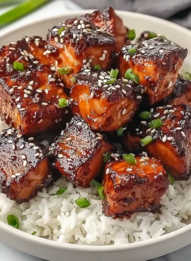 Honey garlic salmon bites served in a flavorful bowl with vegetables