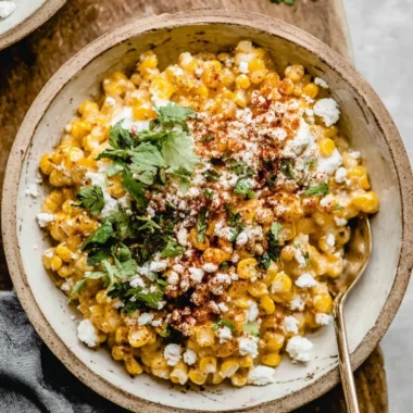Mexican street corn casserole served in a baking dish with toppings