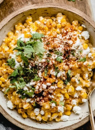 Mexican street corn casserole served in a baking dish with toppings