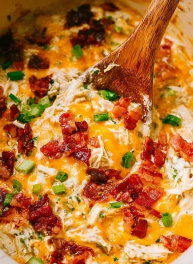 Delicious slow cooker crack chicken served in a bowl with herbs