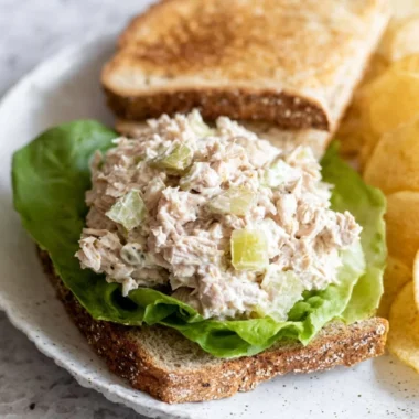 Delicious tuna salad sandwich on whole grain bread with fresh ingredients.