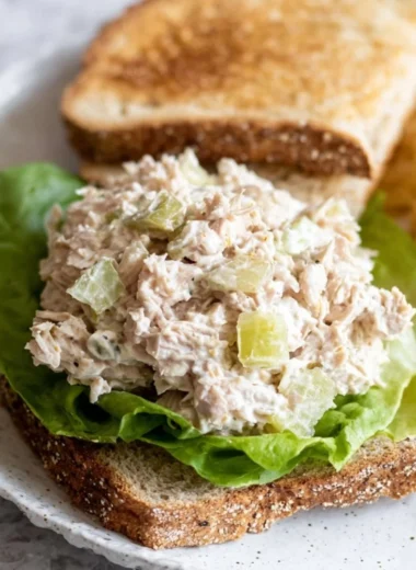 Delicious tuna salad sandwich on whole grain bread with fresh ingredients.