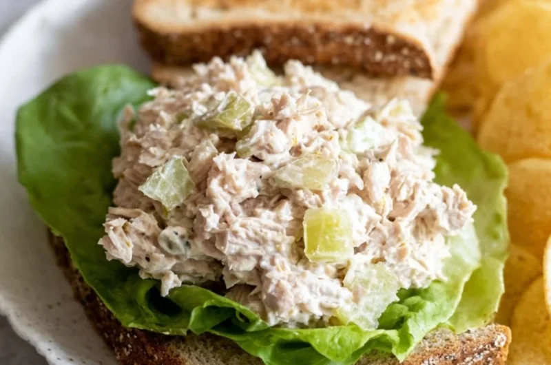 Delicious tuna salad sandwich on whole grain bread with fresh ingredients.