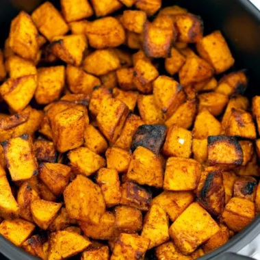 Crispy air fryer sweet potato cubes on a plate