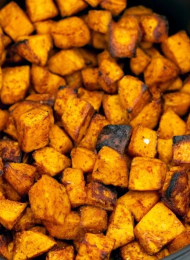 Crispy air fryer sweet potato cubes on a plate