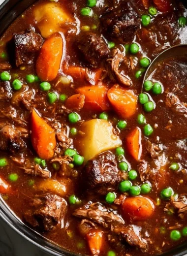 Delicious homemade beef stew with tender meat and vegetables in a rich broth.