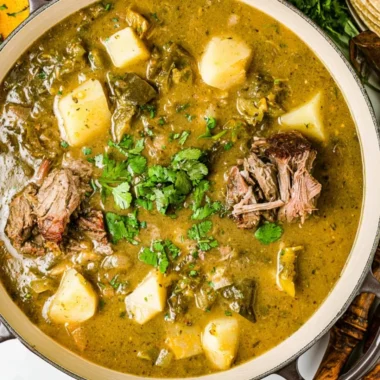 Delicious bowl of Caldillo stew filled with fresh vegetables and meat.