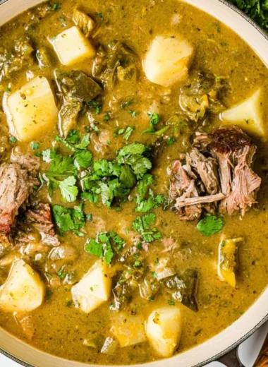 Delicious bowl of Caldillo stew filled with fresh vegetables and meat.