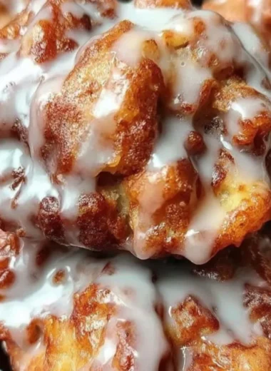 Delicious cinnamon apple fritters served warm and dusted with sugar.