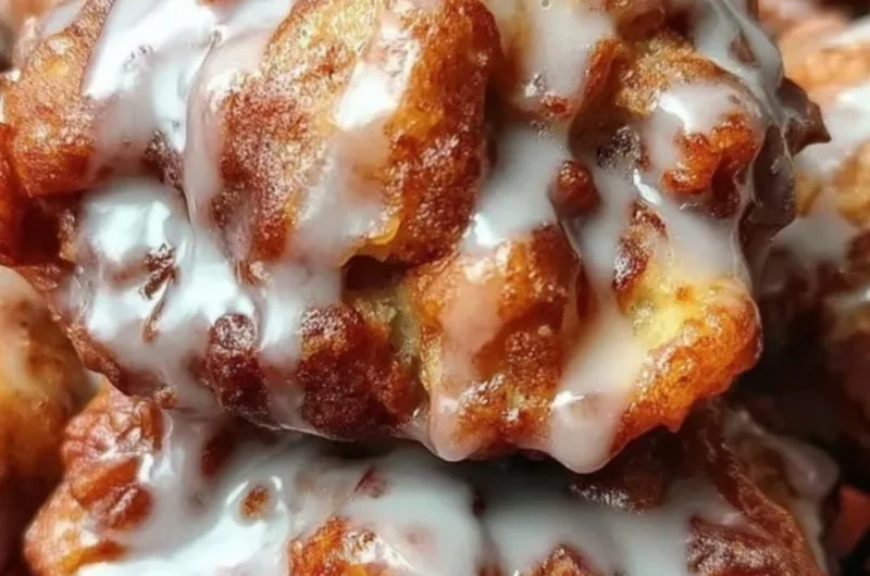 Delicious cinnamon apple fritters served warm and dusted with sugar.