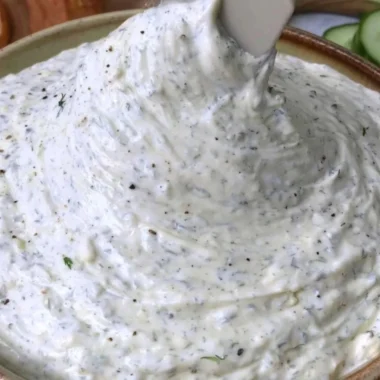 Delicious cucumber dip served with fresh vegetable sticks