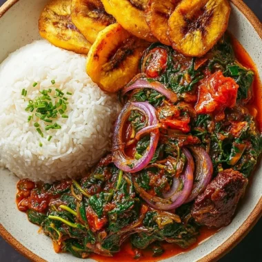 Bowl of Ghanaian Spinach Stew topped with vegetables and spices