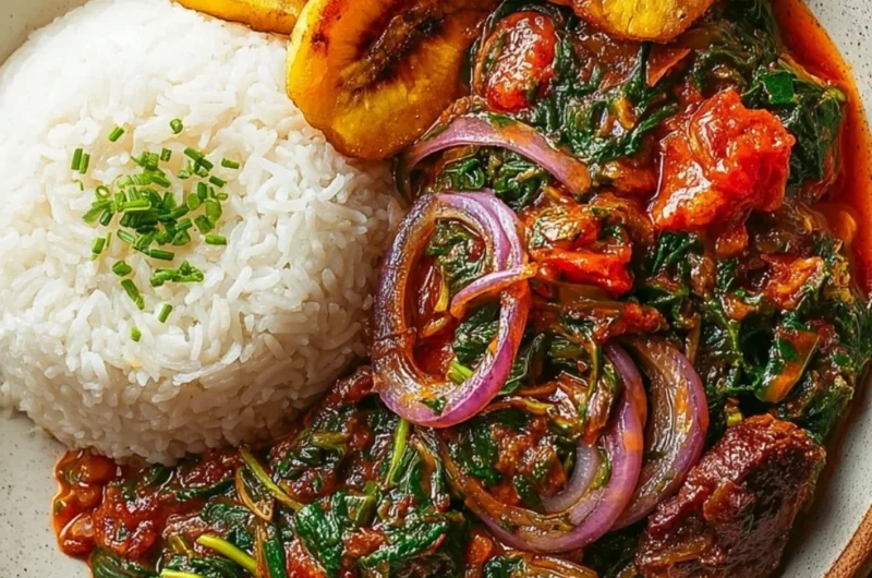 Bowl of Ghanaian Spinach Stew topped with vegetables and spices