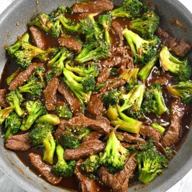 Gluten-free beef and broccoli dish served with rice and vegetables