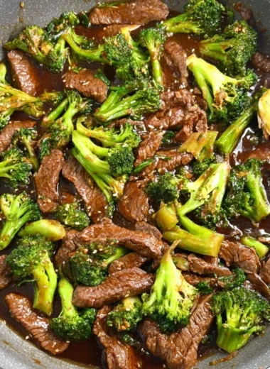 Gluten-free beef and broccoli dish served with rice and vegetables