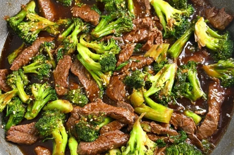 Gluten-free beef and broccoli dish served with rice and vegetables