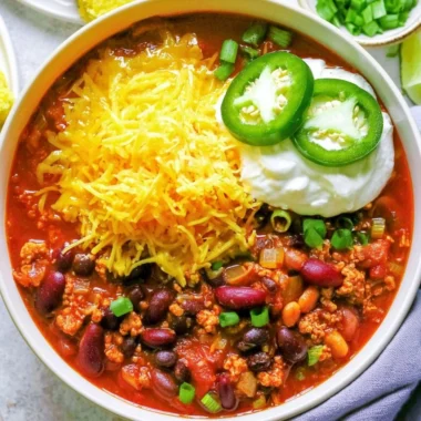 Bowl of healthy turkey chili topped with avocado and cilantro