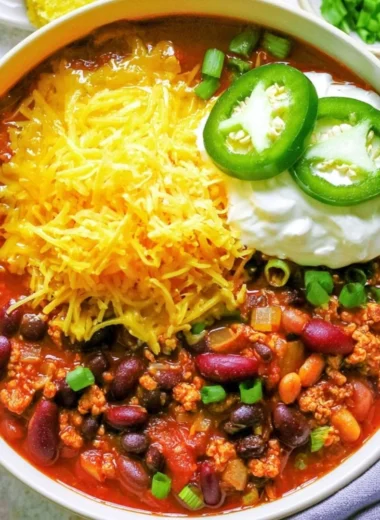 Bowl of healthy turkey chili topped with avocado and cilantro