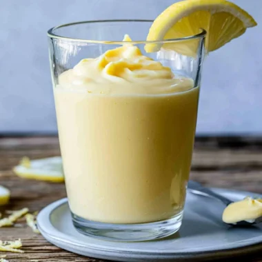 Delicious lemon cream dessert in a bowl with lemon slices
