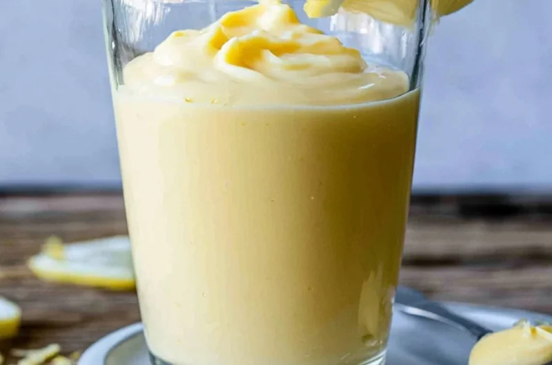 Delicious lemon cream dessert in a bowl with lemon slices