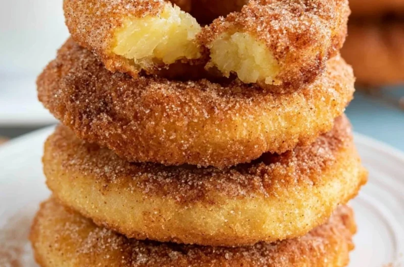 Crispy pineapple fritter rings golden brown and ready to be served.