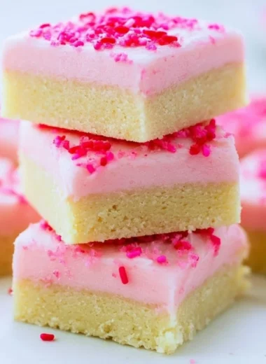 Deliciously baked Sugar Cookie Bars topped with colorful sprinkles