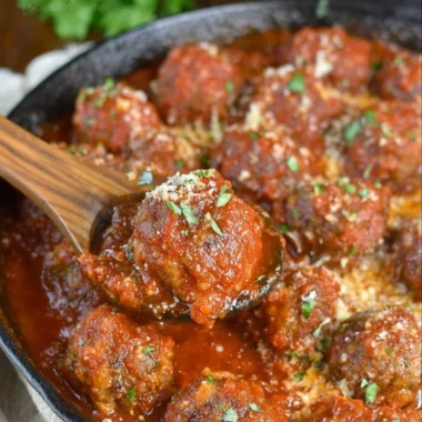 Deliciously cooked Italian meatballs served with pasta and sauce.