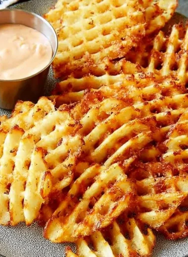 Delicious waffle fries served with homemade dipping sauce
