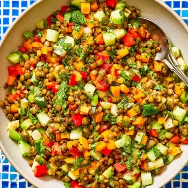 Delicious Mediterranean lentil salad with fresh vegetables and herbs