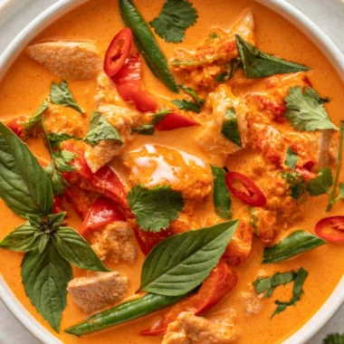Bowl of cozy Thai red curry with chicken and vegetables