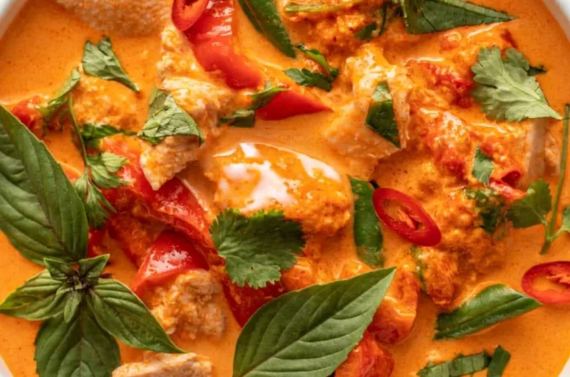 Bowl of cozy Thai red curry with chicken and vegetables