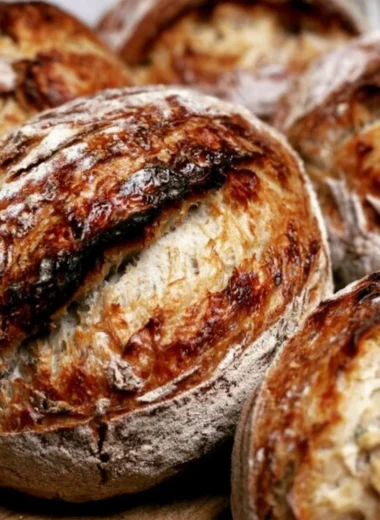 Beginner's sourdough bread recipe showing the process from starter to baked loaf.