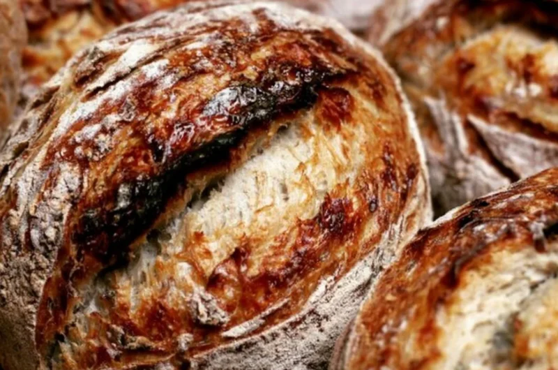 Beginner's sourdough bread recipe showing the process from starter to baked loaf.