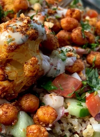 Cozy Cauliflower Shawarma Bowl garnished with fresh vegetables and sauce