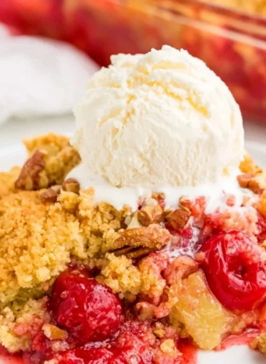Cozy cherry dump cake topped with a golden crumble and fresh cherries