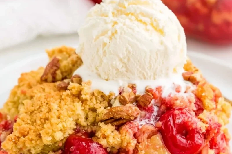 Cozy cherry dump cake topped with a golden crumble and fresh cherries