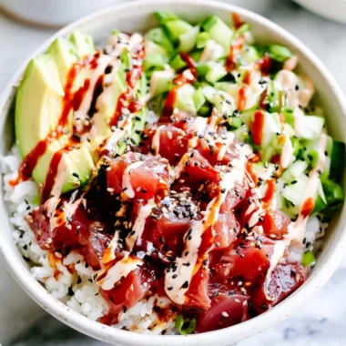 Cozy spicy tuna poke bowl with fresh ingredients and vibrant toppings