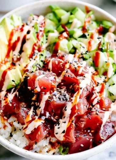 Cozy spicy tuna poke bowl with fresh ingredients and vibrant toppings