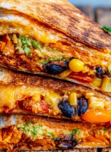Delicious vegetarian quesadillas served with fresh toppings and salsa
