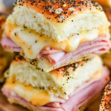 Ham and cheese sliders on a platter, perfect for gatherings and parties.