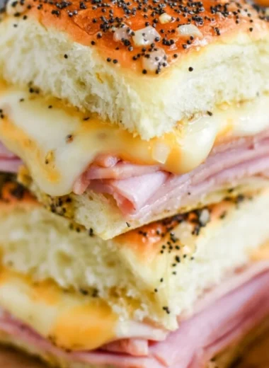 Ham and cheese sliders on a platter, perfect for gatherings and parties.