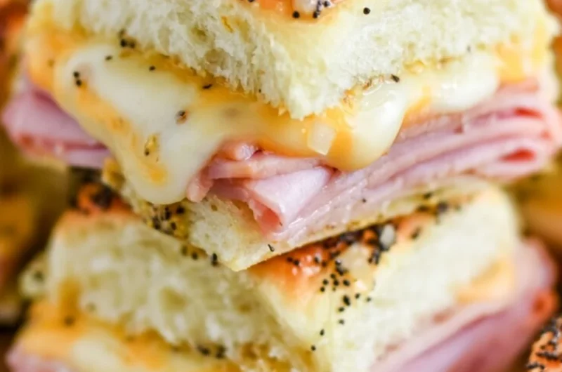 Ham and cheese sliders on a platter, perfect for gatherings and parties.